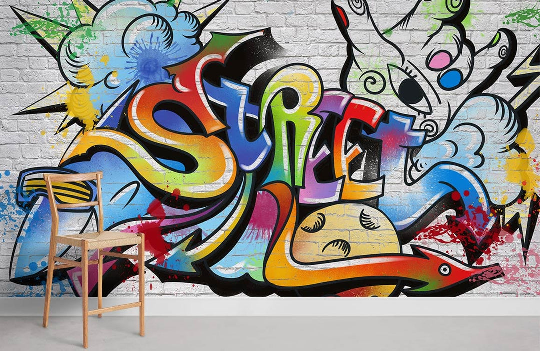 Colourful 'Urban Graffiti Vibes' mural wallpaper, vibrant design, white brick, modern wooden chair, interior.