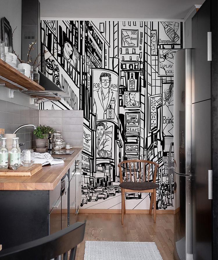 Monochrome Urban Cityscape Mural Wallpaper in a modern kitchen with wood flooring and sleek decor.