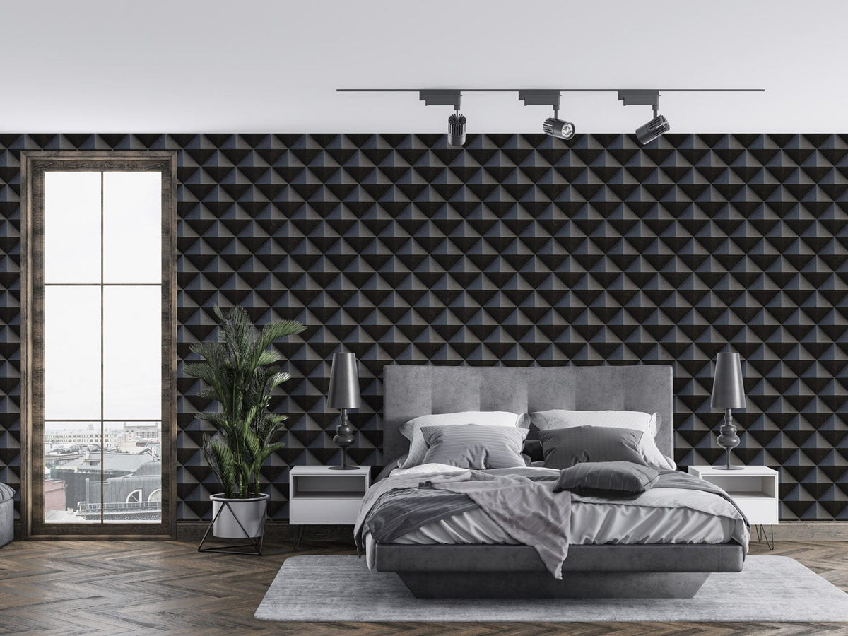 Luxurious geometric 3D wallpaper in bedroom; grey bed, herringbone flooring, elegant lamps, modern decor.