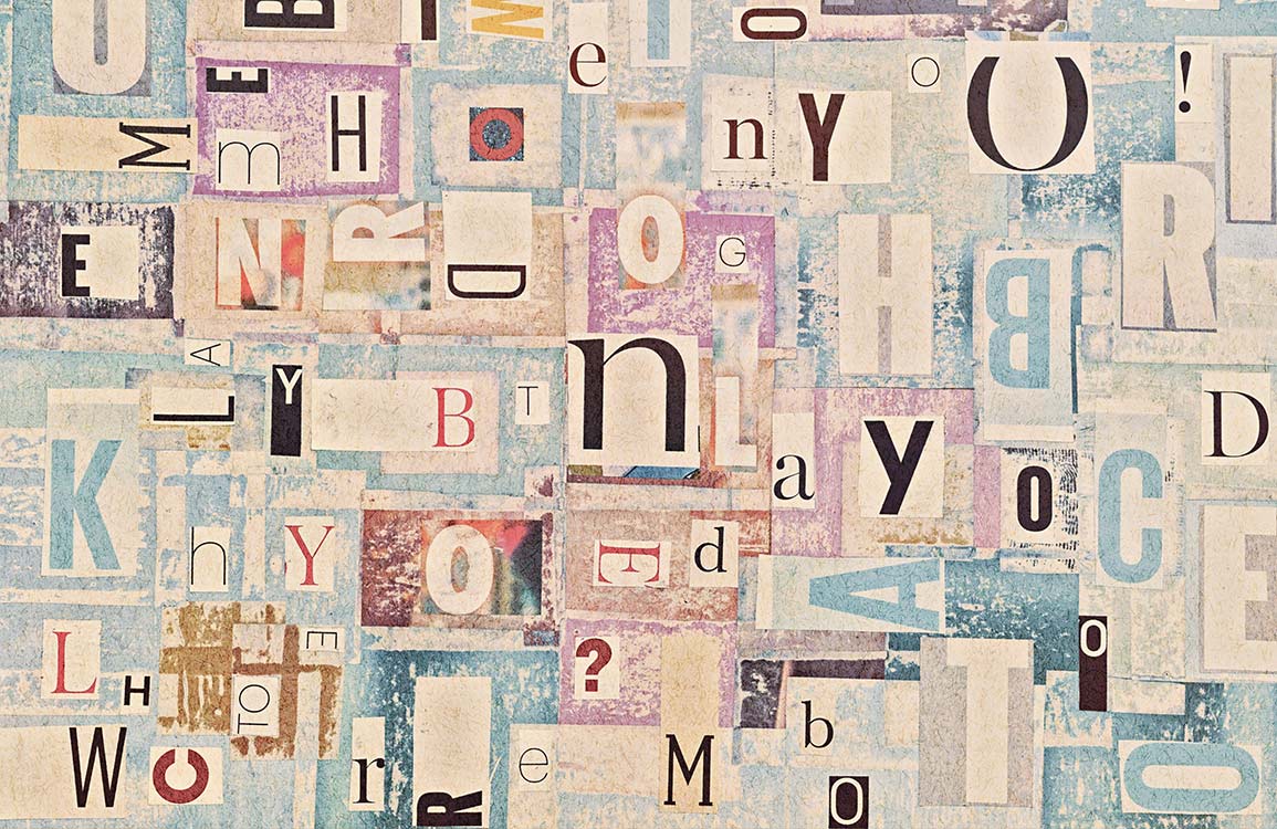 Vintage Typography Collage Mural Wallpaper - Pastel Blue and Textured Letters
