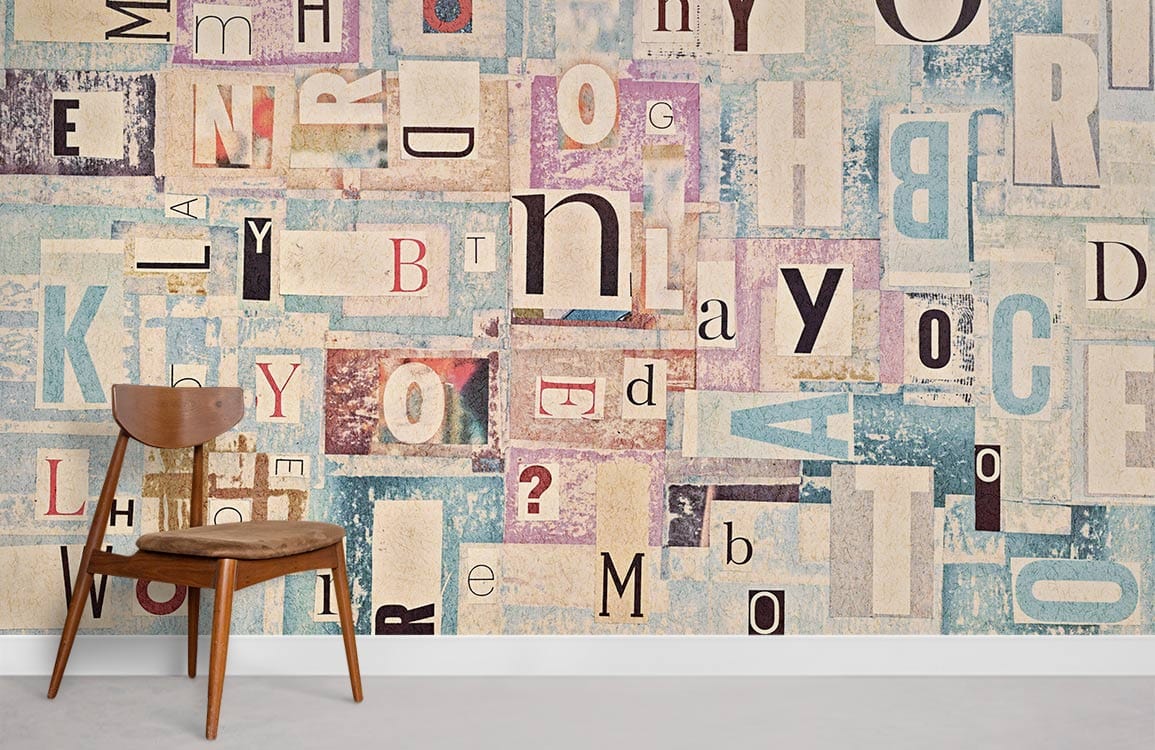 Vintage Typography Collage Mural Wallpaper with pastel blue and textured letters, mid-century wooden chair.