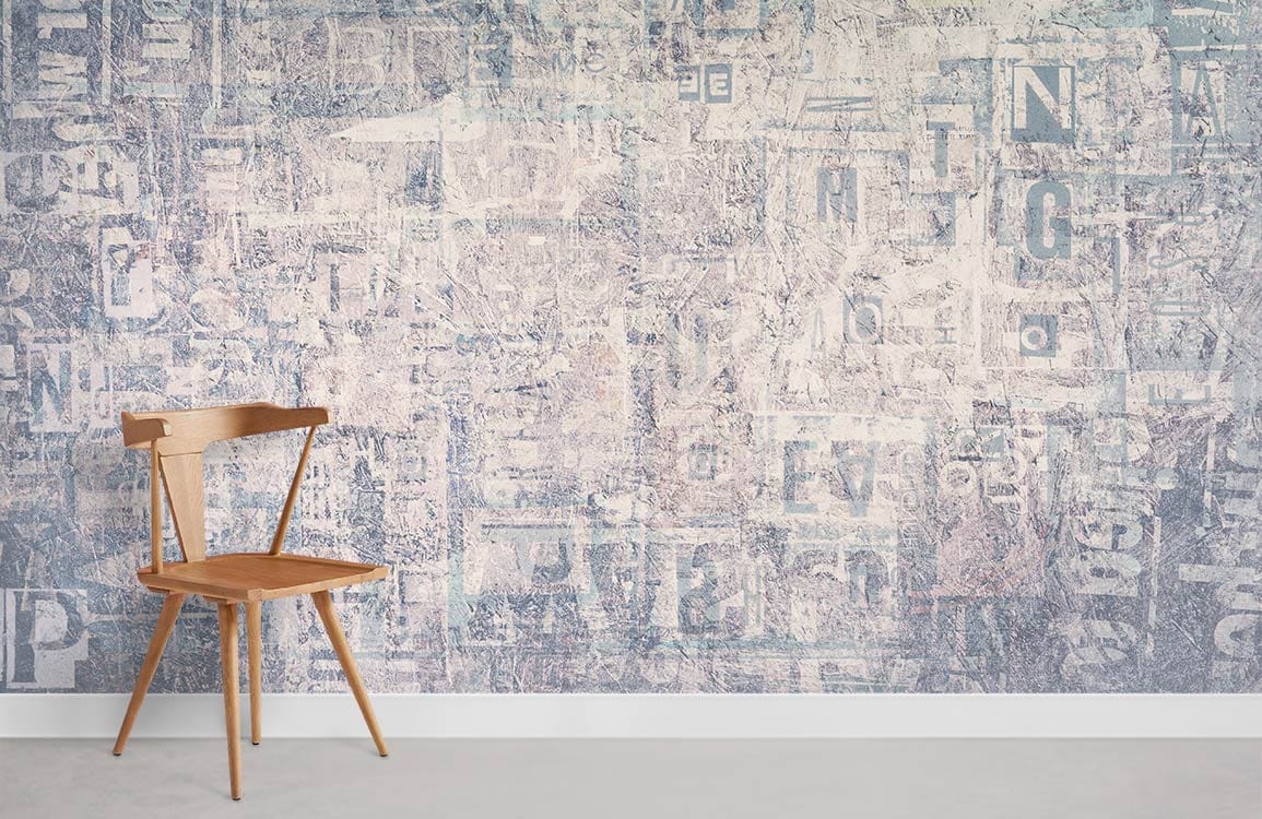 Vintage industrial mural wallpaper, blue typographic collage, wooden chair, minimalist room with light flooring.