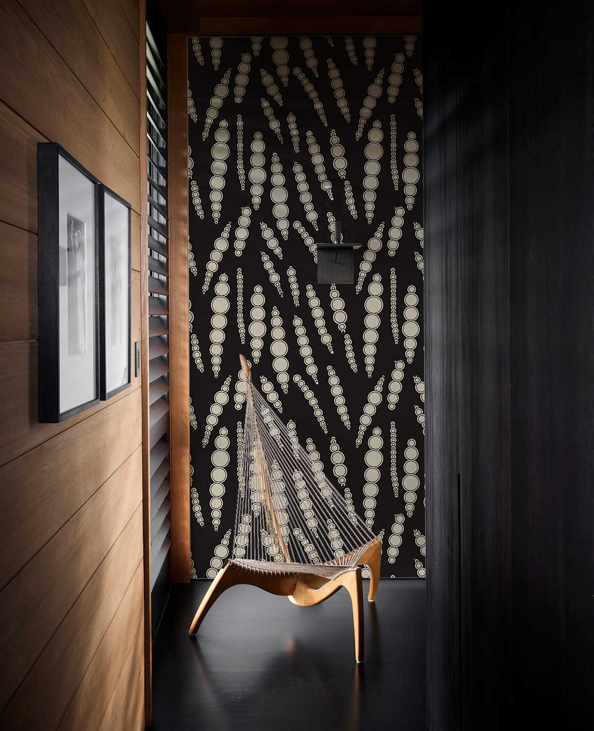 Elegant Charcoal Geometric Dots Wallpaper, wooden accent wall, artistic chair, modern hallway design.