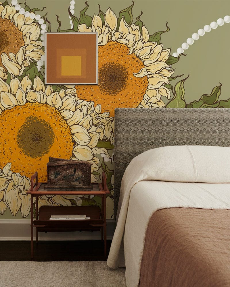 Vintage Sunflower and Pearls Mural Wallpaper in bedroom with grey headboard and wooden bedside table.