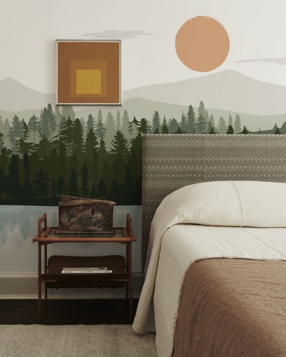 Scenic Forest Landscape Mural Wallpaper; bedroom decor, patterned headboard, dark wood side table.