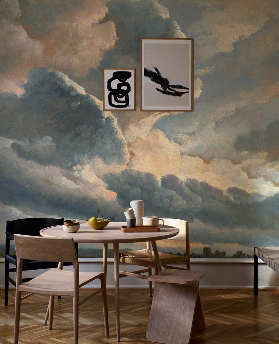 Romantic Sky Mural Wallpaper in pastel hues, dining room with wooden furniture, parquet flooring.