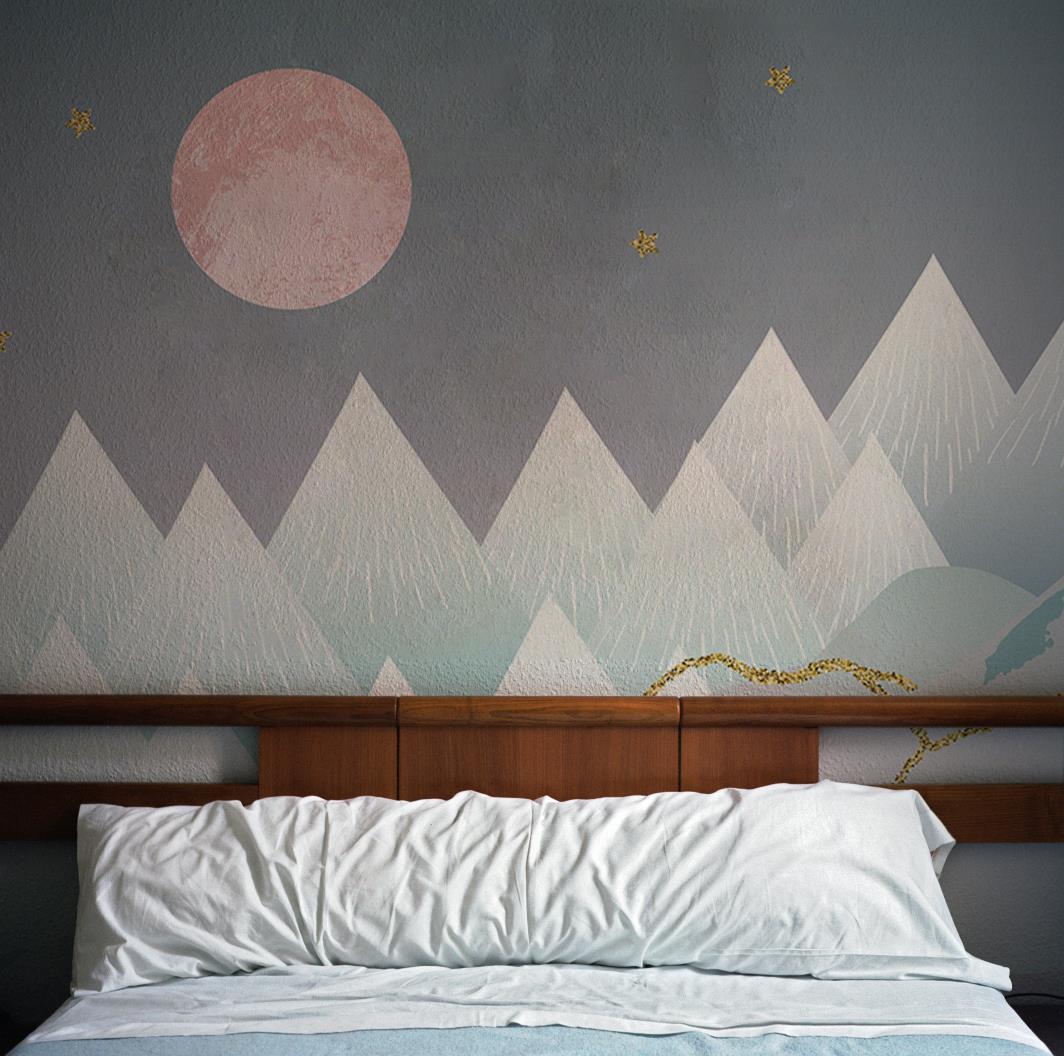 Dreamy mountain landscape mural in pink and blue pastels, wooden headboard, cosy bedroom setting.
