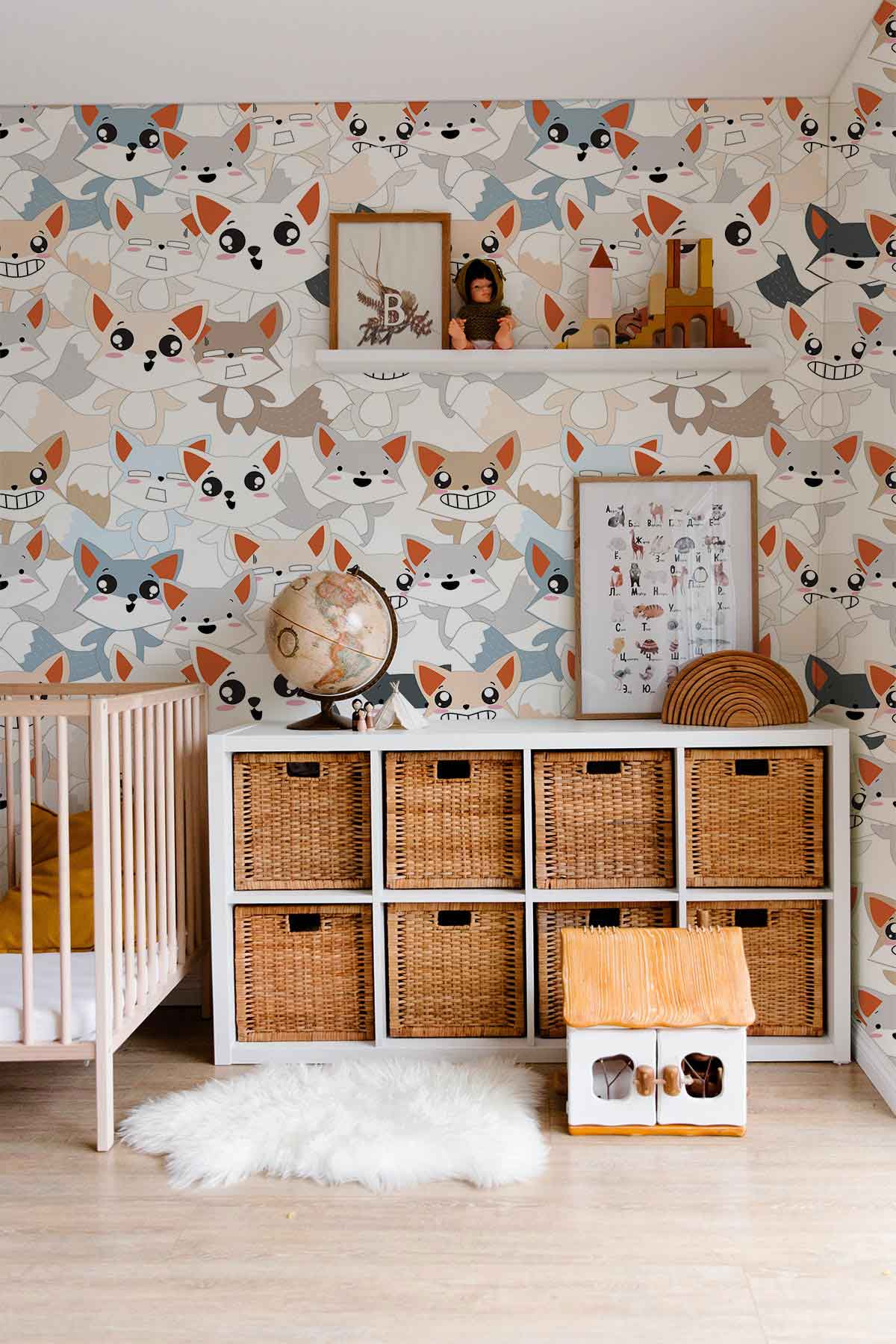 Playful Fox Friends nursery wallpaper, colourful with storage unit, beige crib, wooden flooring, cosy rug.