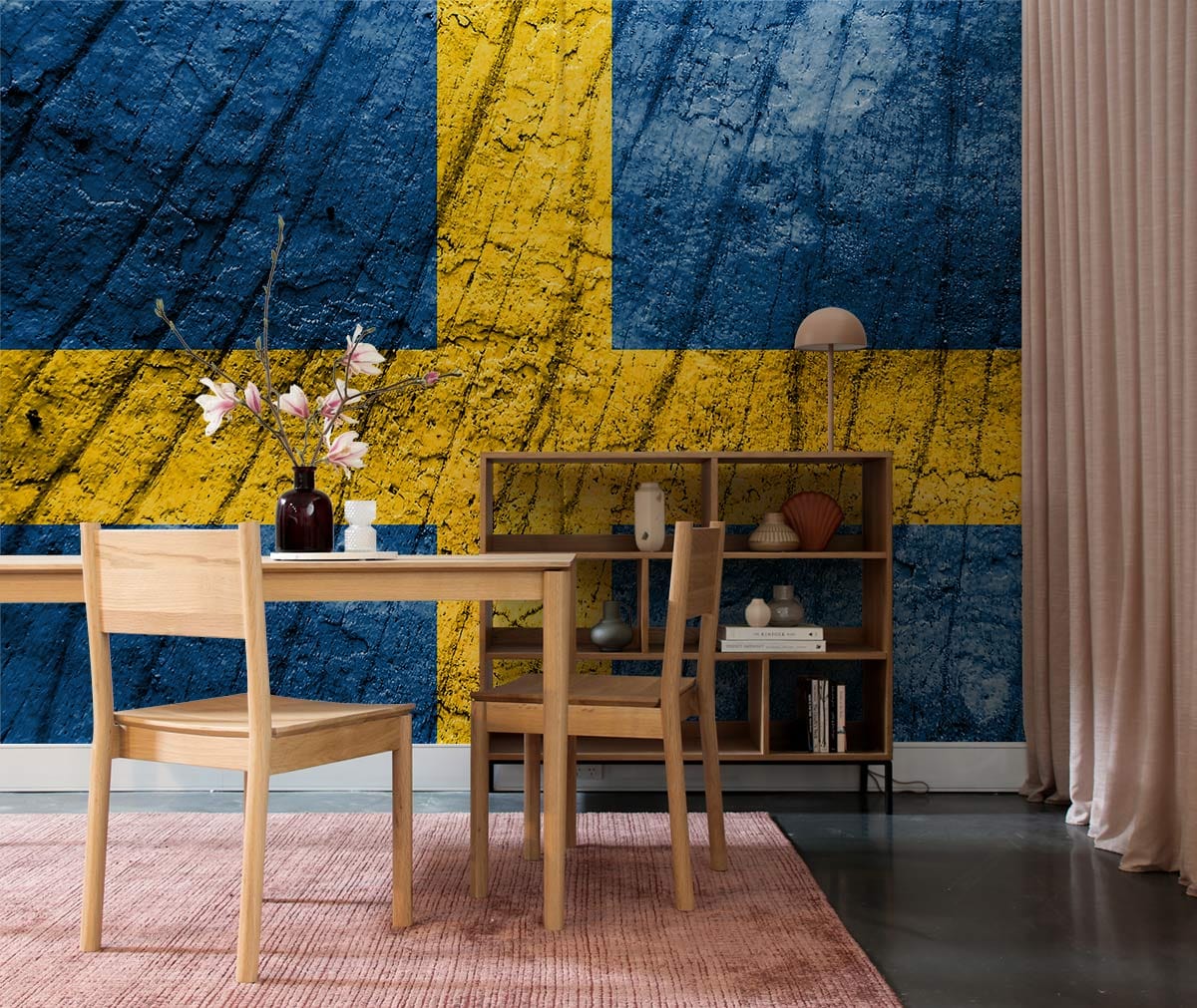 Rustic Swedish flag wallpaper mural in dining room with wooden furniture, pink rug, and textured design.