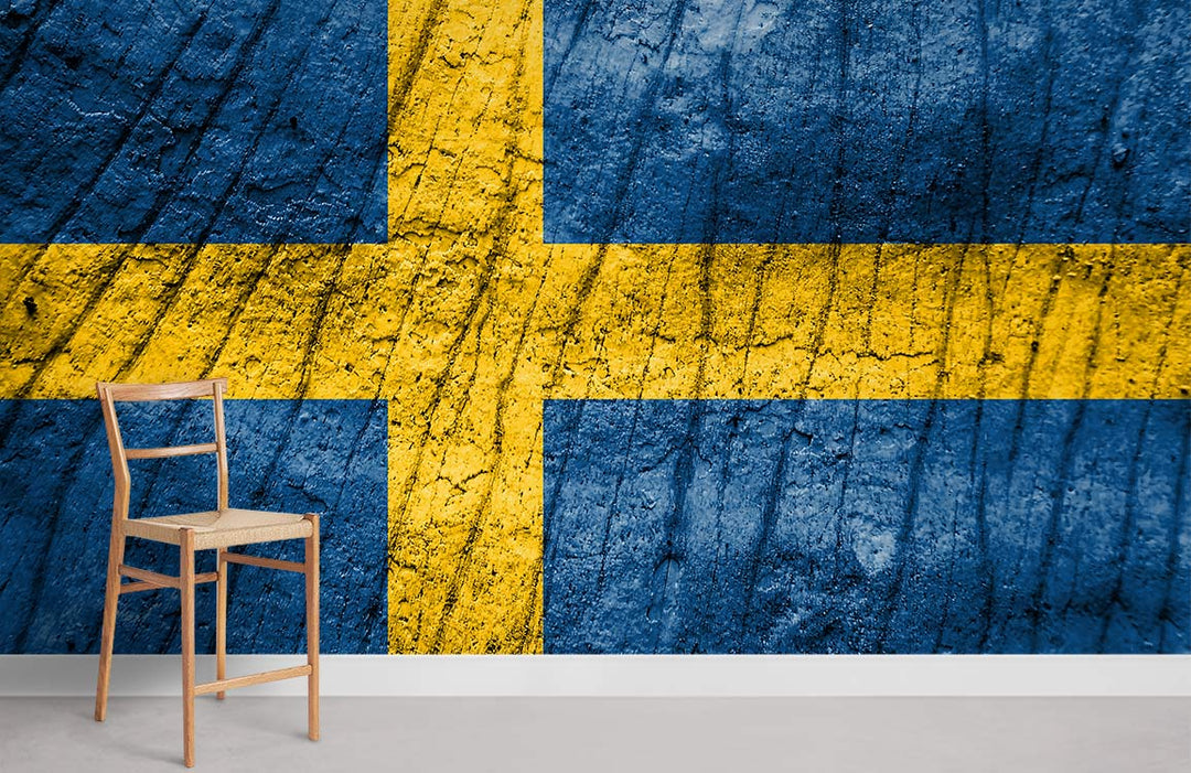 Rustic Swedish flag wallpaper mural with wooden chair, textured blue wall, grey flooring in modern room.