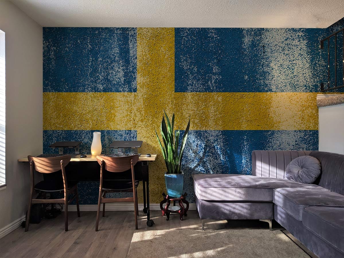 Vintage Swedish Flag mural wallpaper in blue-yellow for Nordic interiors, grey sofa, wood flooring, dining table.