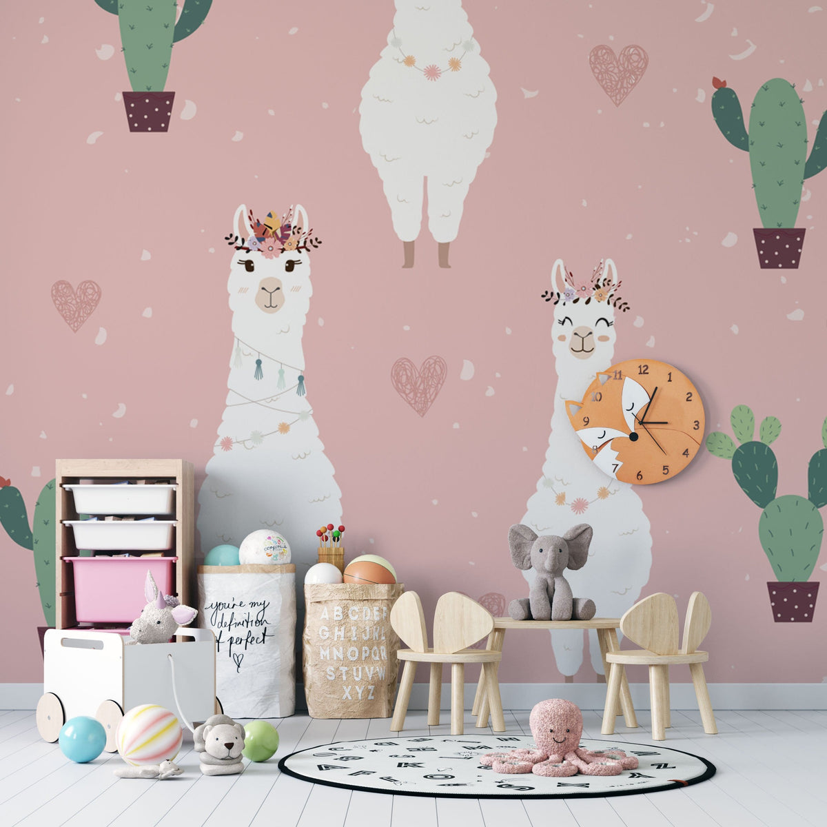 Charming llama wallpaper in pink nursery with wooden furniture and playful decor elements.