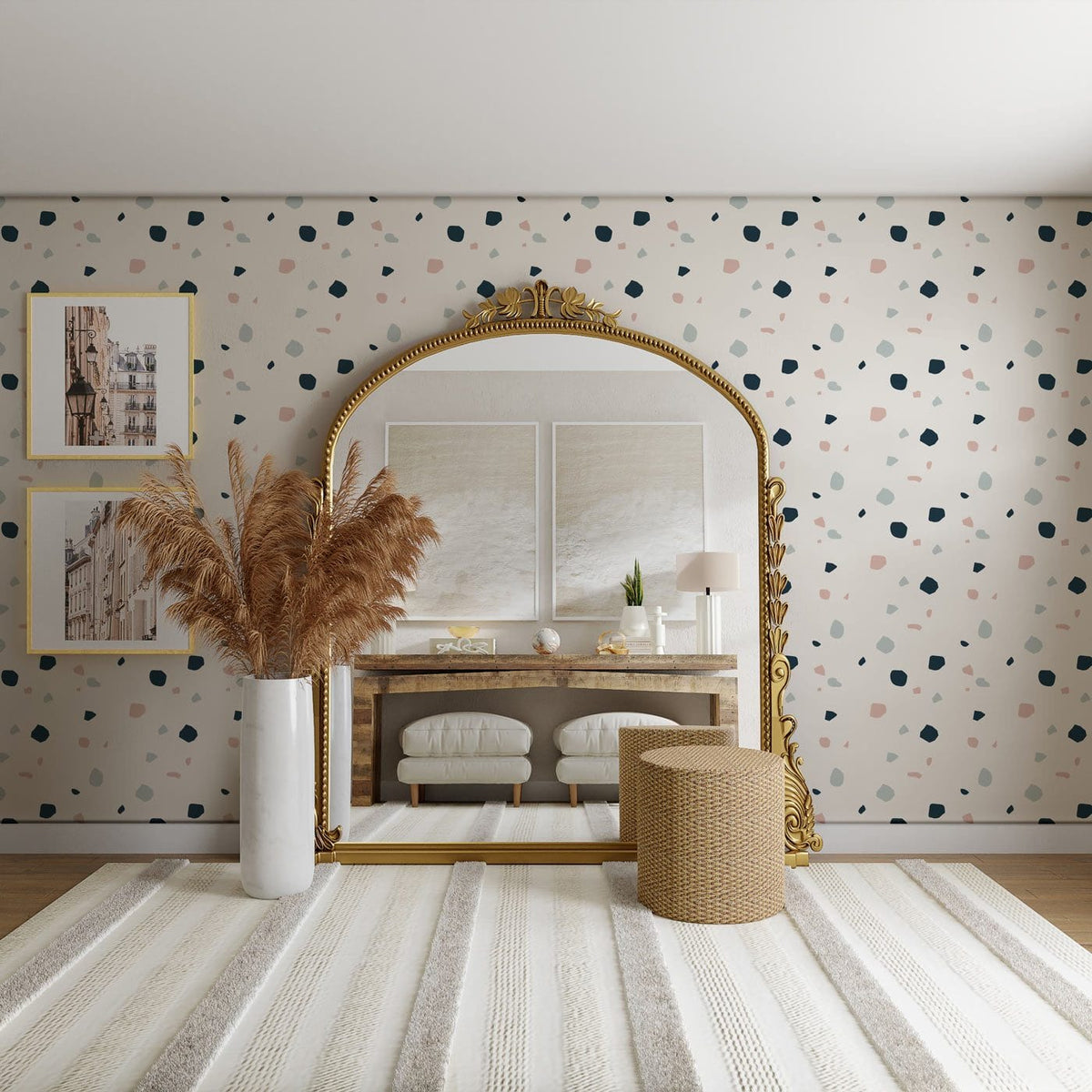 Classic black polka dot wallpaper, elegant gold-framed mirror, neutral rug, and modern seating in living room.