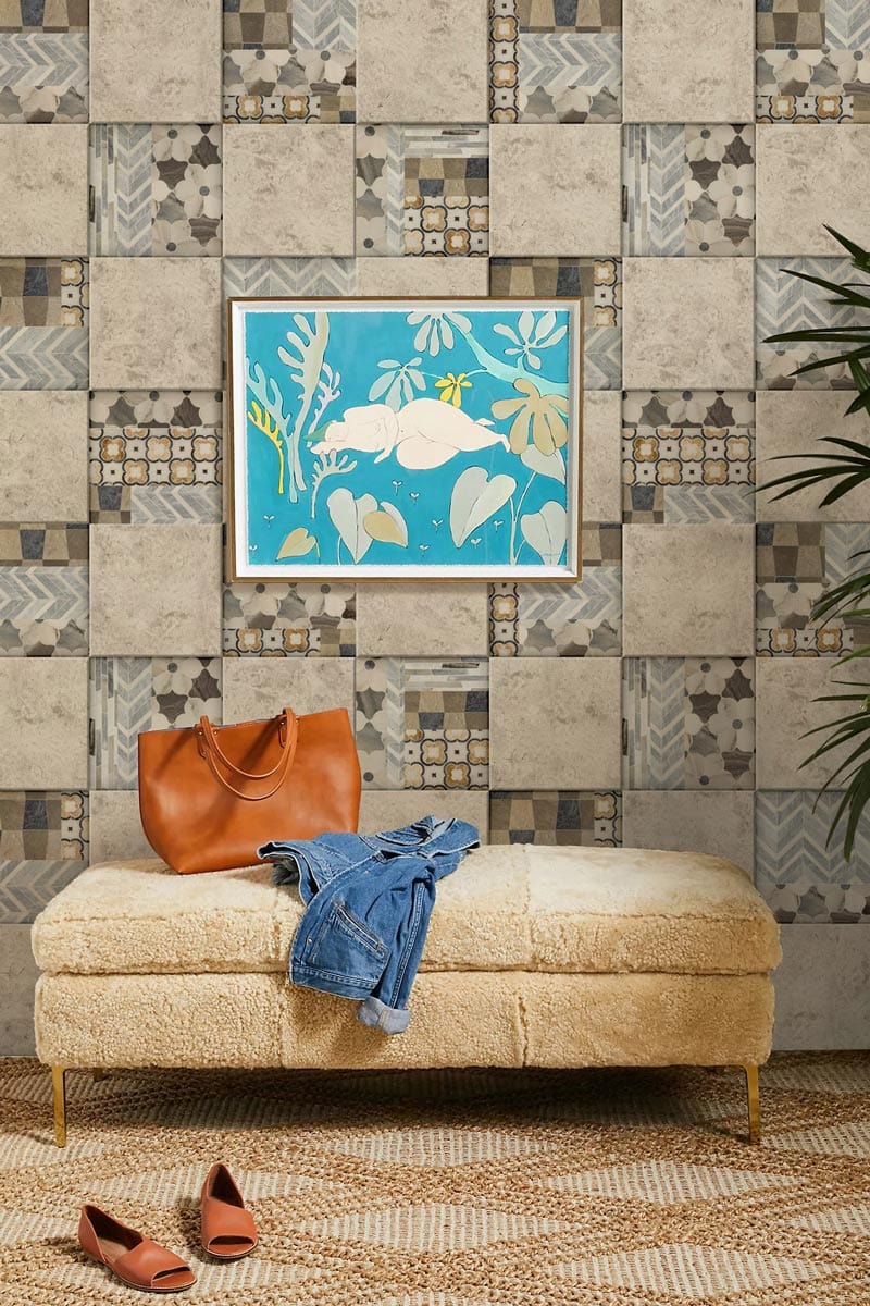 Vintage Patchwork Geometric Tiles Wallpaper in neutral tones, featuring beige ottoman, abstract artwork, woven rug.
