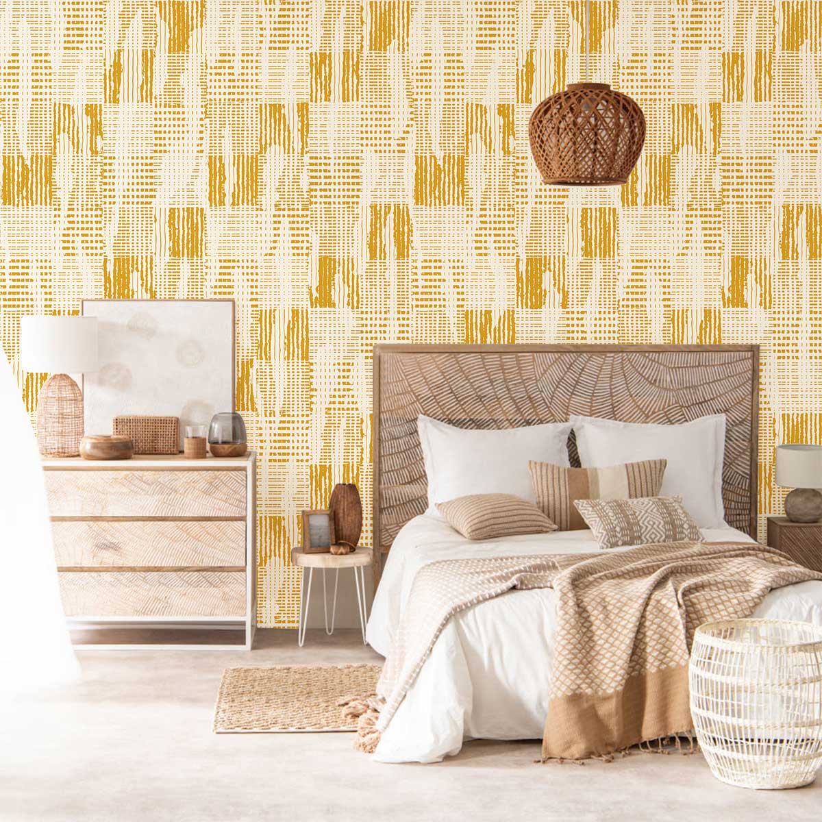 Vintage mustard geometric wallpaper, stylish bedroom decor, woven lamp, natural wood furniture, cosy bedding.