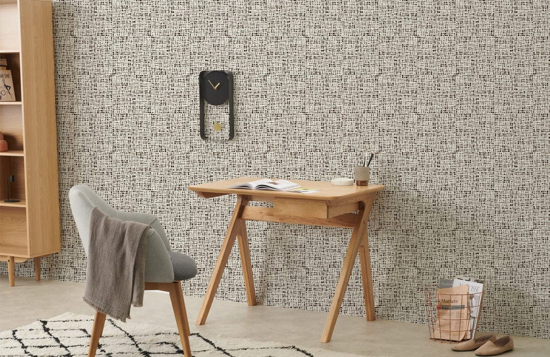 Classic geometric wallpaper, wooden desk, grey chair, elegant interiors, modern design, neutral tones.