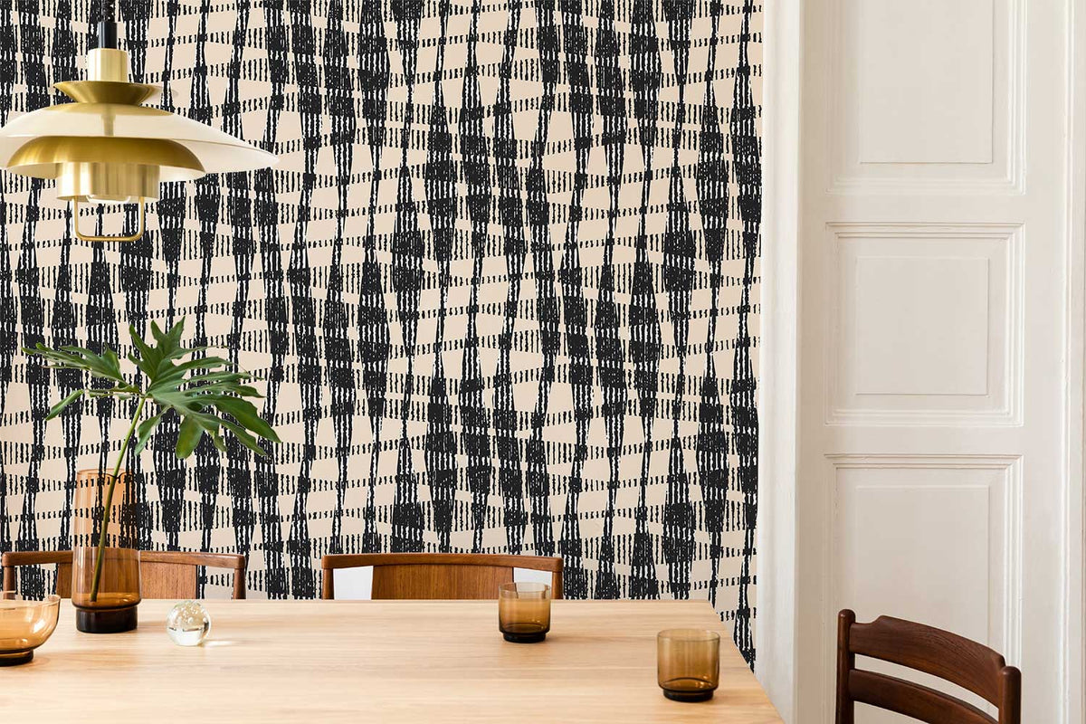 Modern black beige geometric wallpaper with wooden dining table, chairs, and gold pendant in stylish interior.