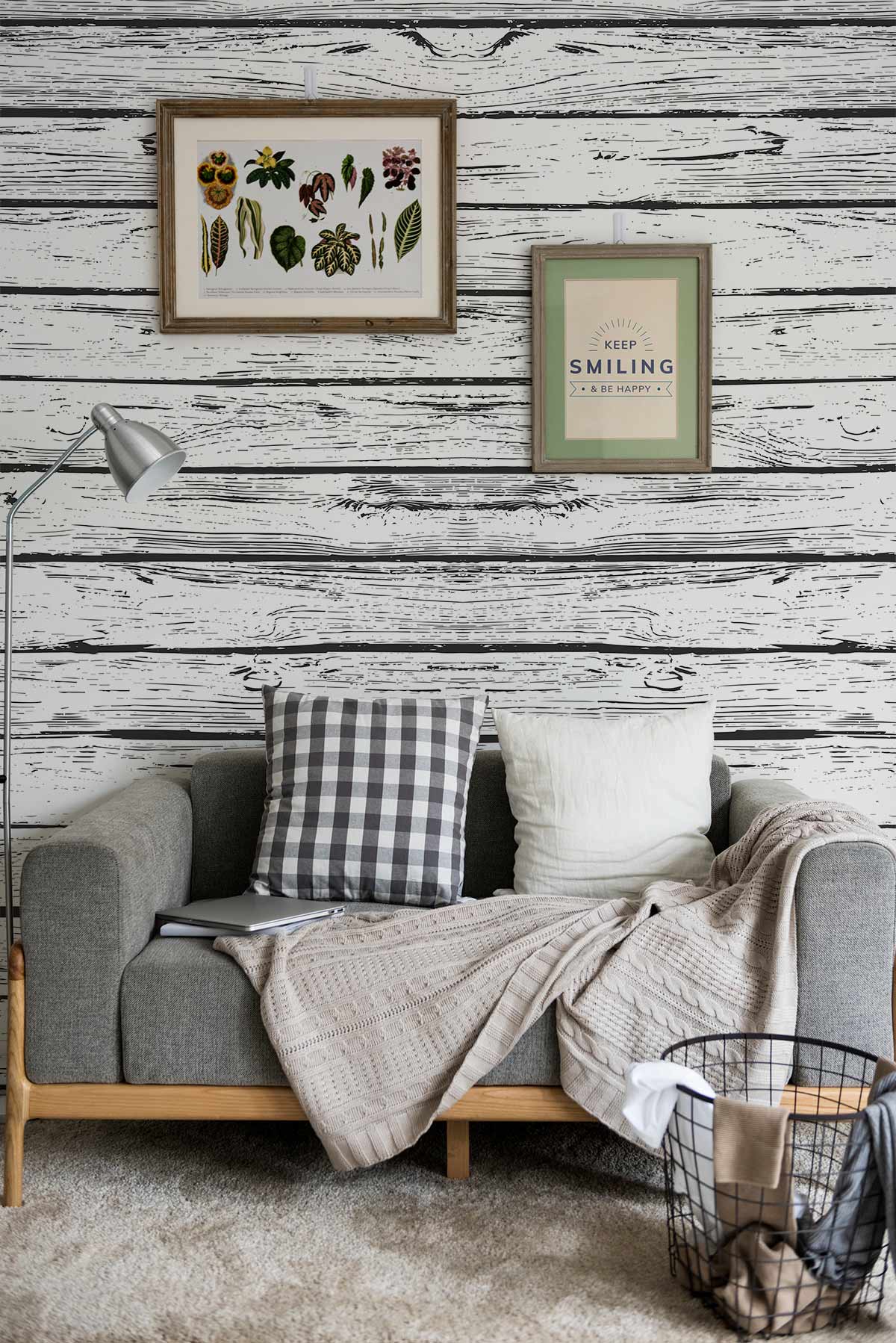 Vintage Rustic White Wood Plank Wallpaper in living room with grey sofa, wall art, and lamp.