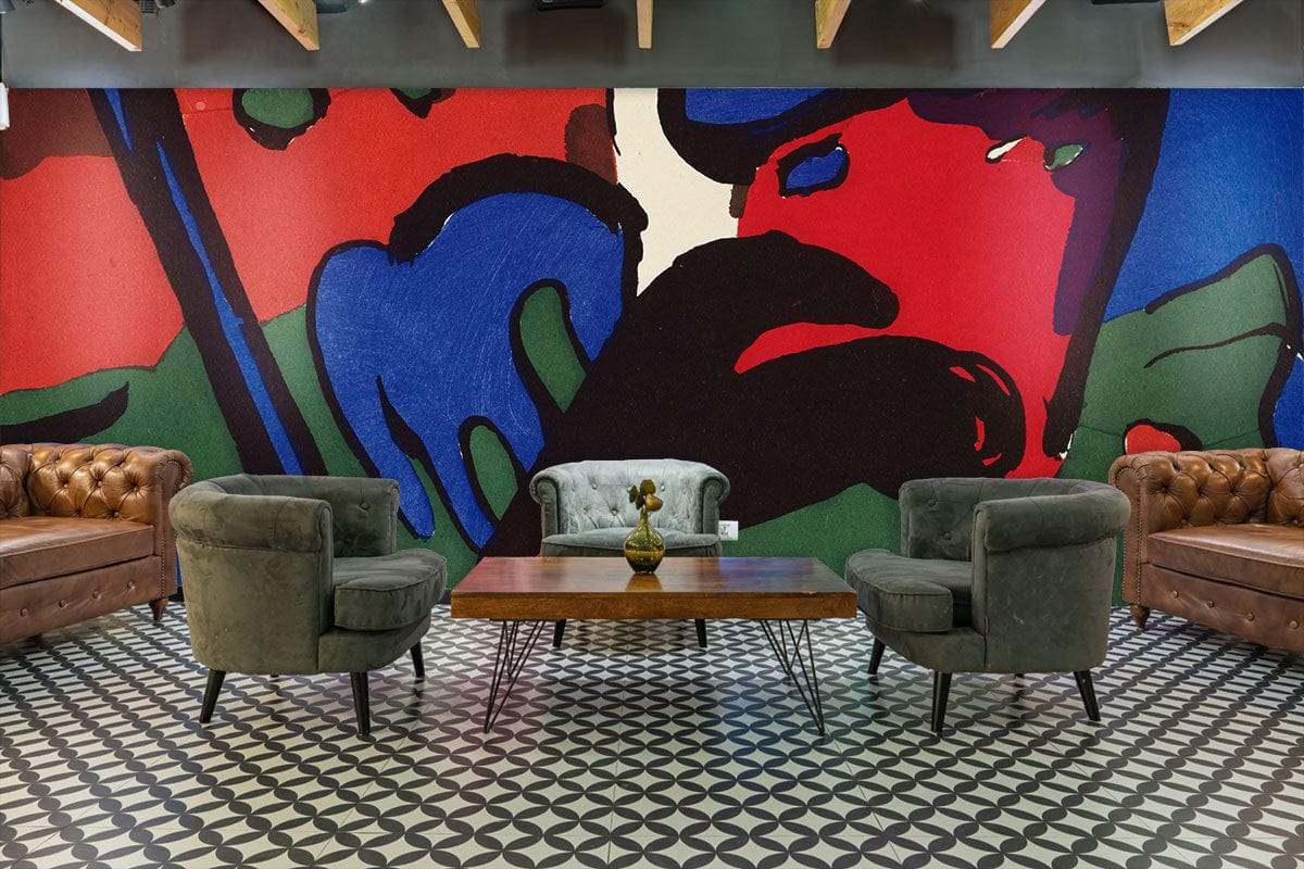 Vibrant abstract geometric mural wallpaper in modern living room with brown sofas and patterned flooring.