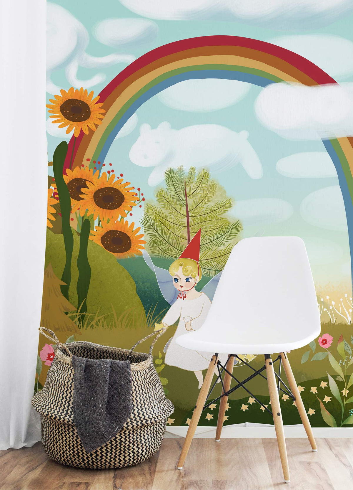 Whimsical Fairy Tale Rainbow and Angel mural wallpaper for kids' rooms, featuring basket, white chair, light wood flooring.