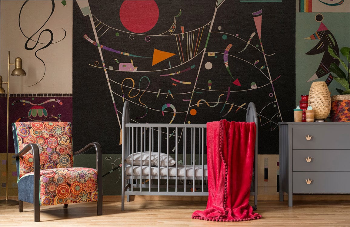 Modern nursery with abstract geometric wallpaper, colourful armchair, grey crib, hardwood flooring, and red blanket.