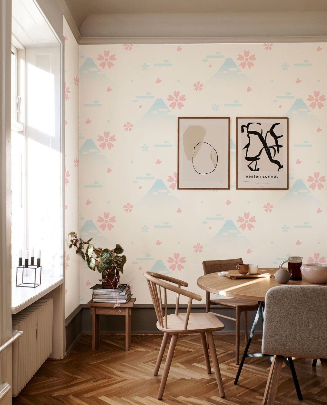 Tranquil Pastel Mountain and Cherry Blossom wallpaper in dining room with wooden chairs, parquet flooring.