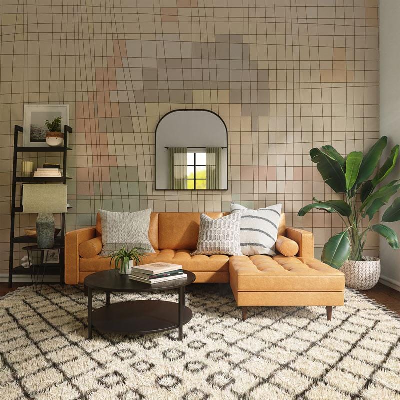 Abstract geometric wallpaper in neutral tones, featuring orange sofa, patterned rug, and decorative mirror.