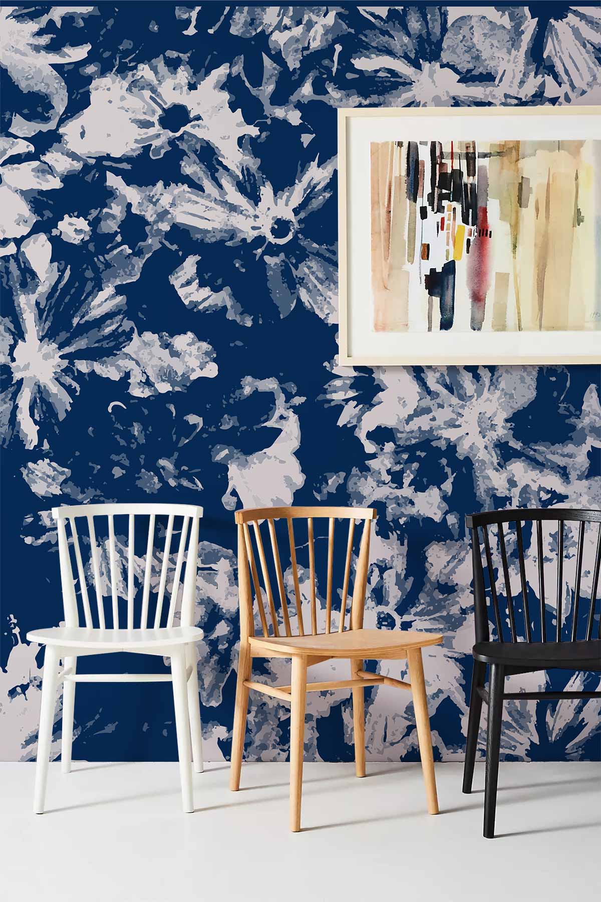 Navy floral wallpaper with white, oak, black chairs; modern artistic painting, stylish home Décor.