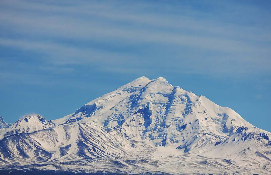 Majestic Snow-Capped Mountain Mural Wallpaper in Tranquil Blue Skies Design