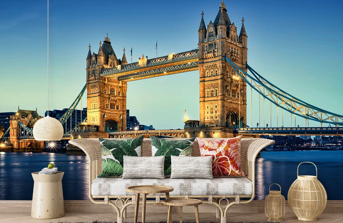 Cosy lounge with London Tower Bridge mural, neutral sofa, colourful cushions, wooden flooring, elegant decor.