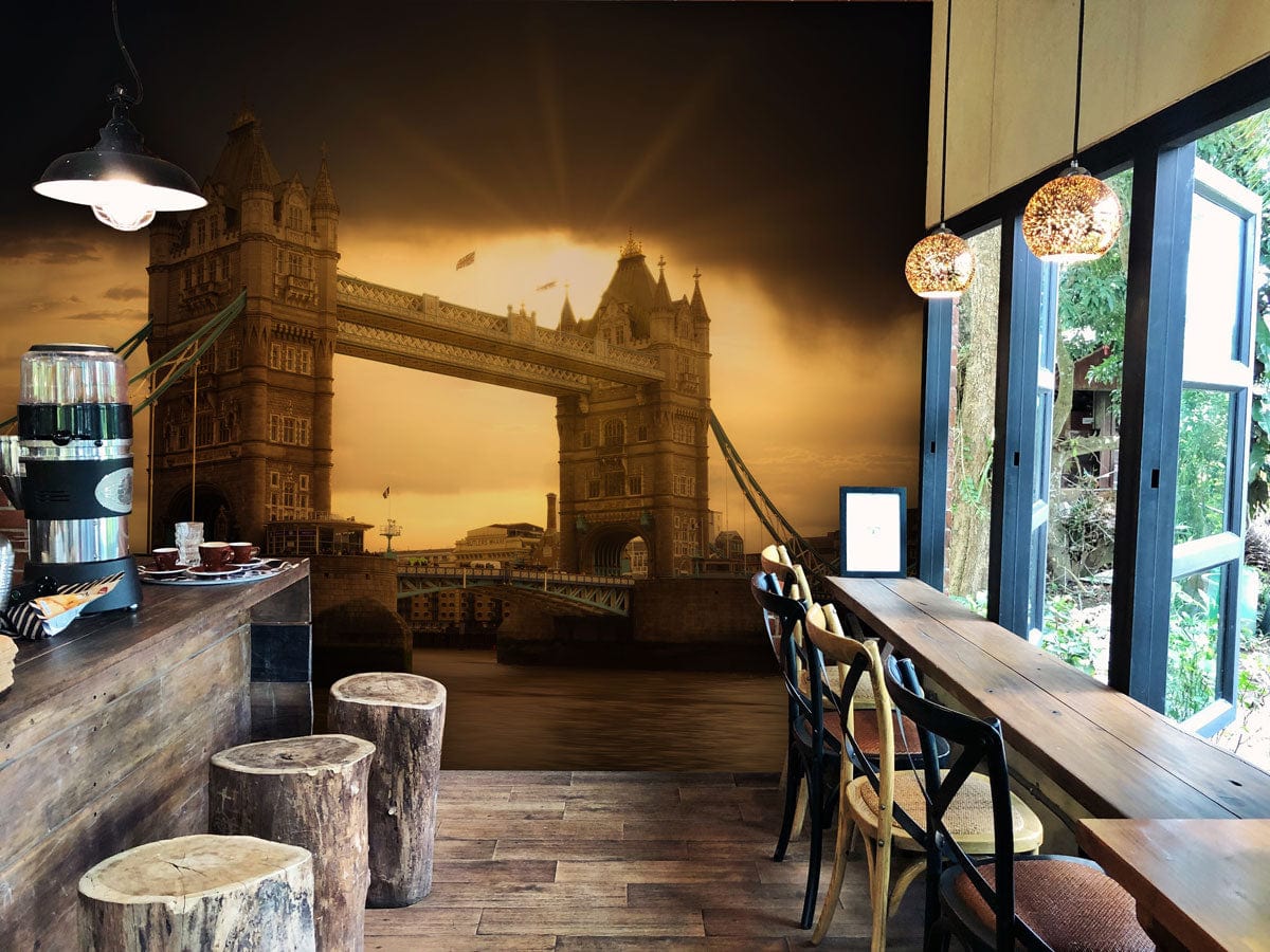 Vintage Sunset London Bridge Scenic Mural Wallpaper, café setting with rustic stools, wooden flooring.