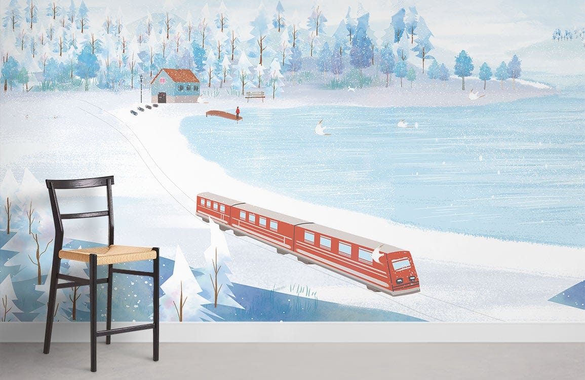 Scenic winter landscape mural wallpaper in blue and white, featuring train, with black chair, grey floor.