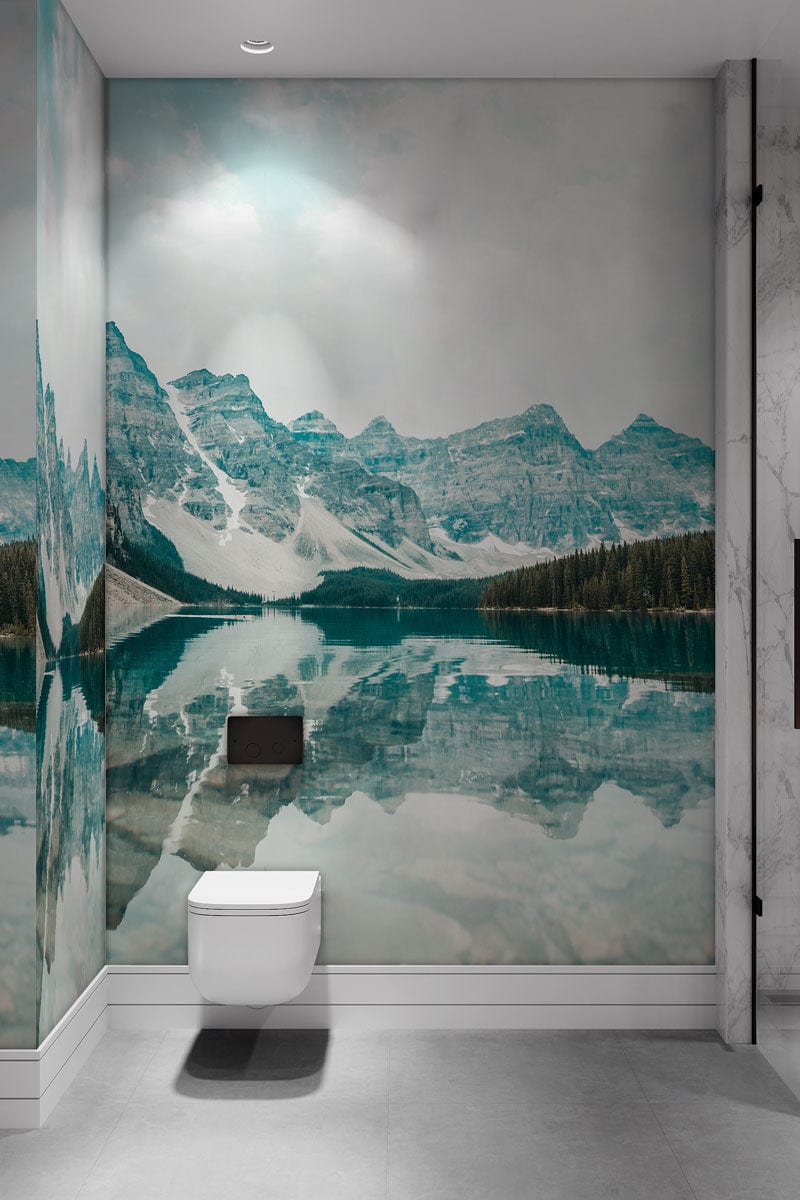 Serene Teal Mountain Lake Mural Wallpaper in modern bathroom with grey flooring and minimalist decor.