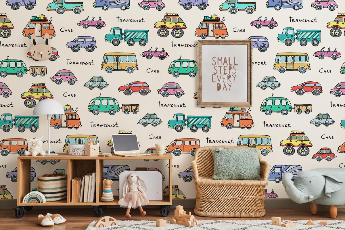 Colourful vintage cars wallpaper, children's room transport theme; wicker chair, light wood shelves, rug.