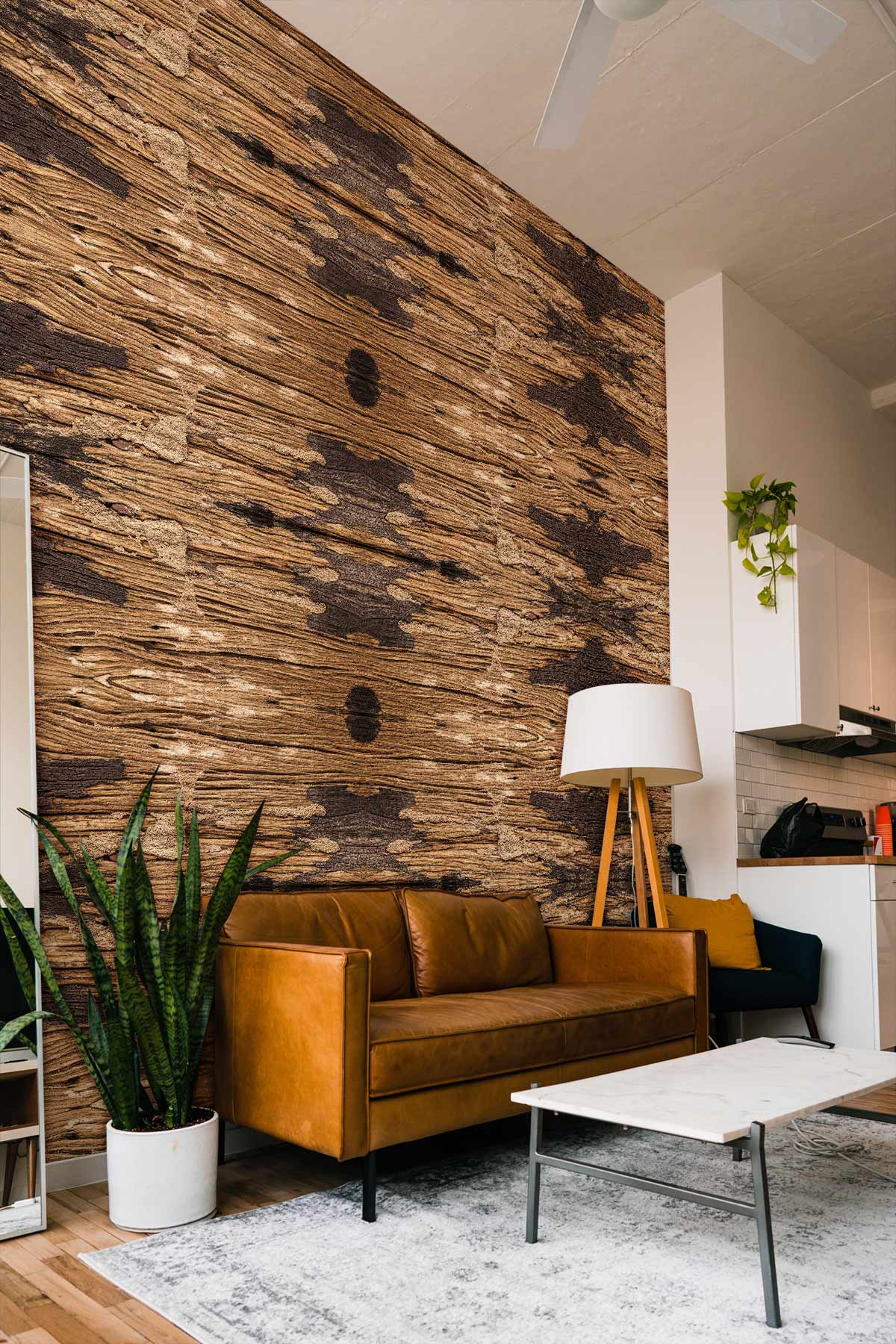 Rustic brown tribal pattern wallpaper in living room with leather sofa, wooden flooring, and modern decor.
