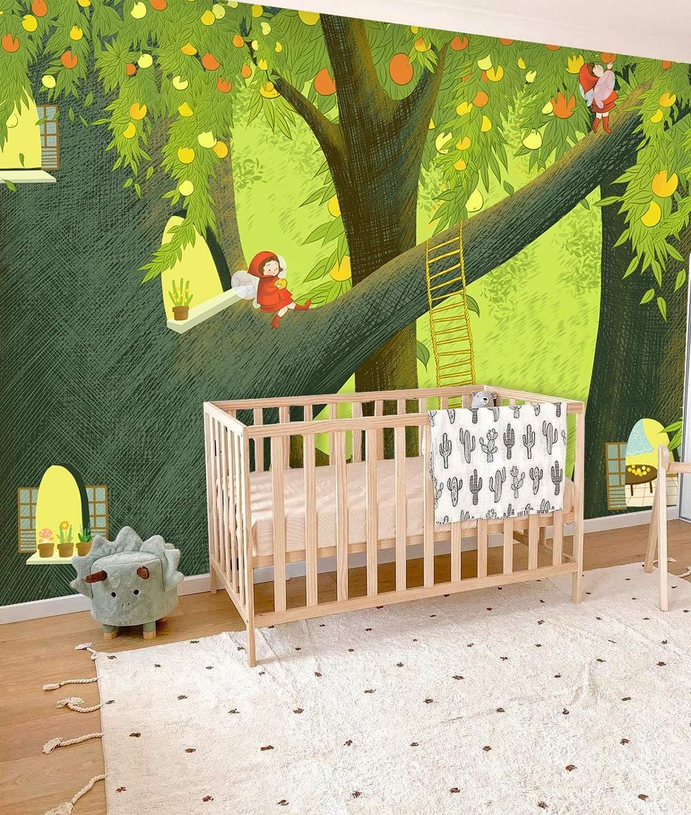 Enchanted Forest mural in nursery with wooden cot, colourful tree design, and plush dinosaur toy.