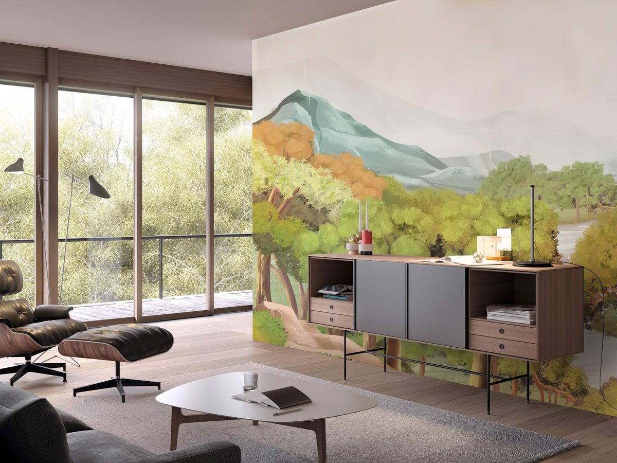 Serene Mountain Forest Mural in green tones, modern lounge chair, wooden sideboard, grey rug, cosy living room.