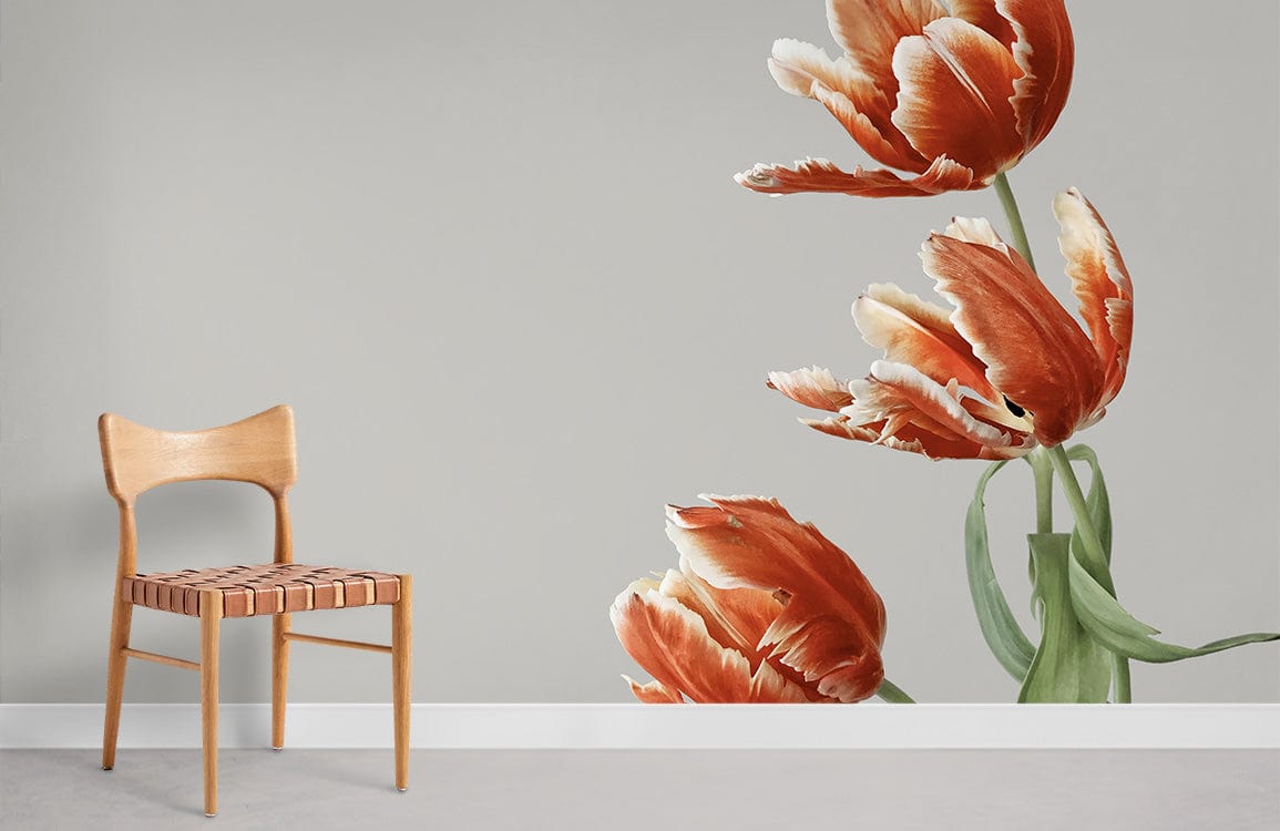 Elegant vintage tulip mural wallpaper in soft orange and green with wooden chair, grey floor.