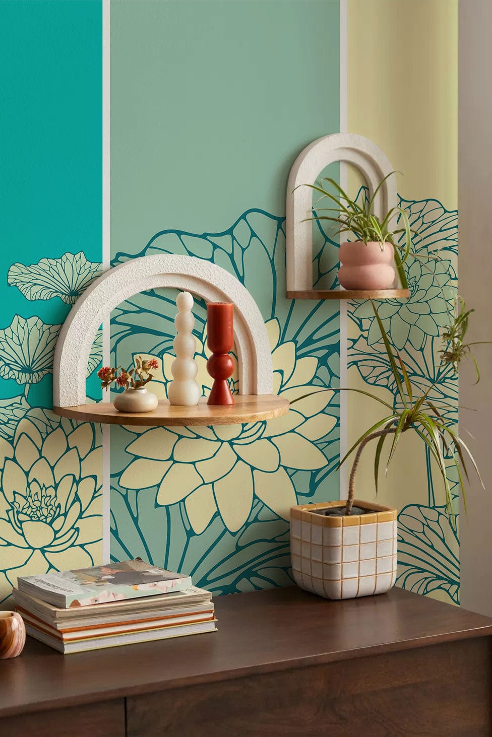 Elegant teal and yellow lotus floral mural wallpaper, botanical design, wooden shelves, modern decor.