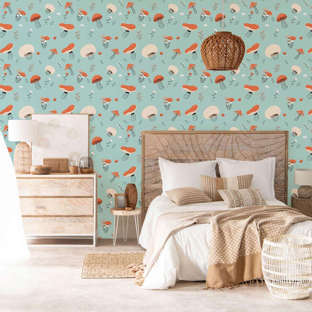 Whimsical teal mushroom wallpaper in bedroom with wicker bed, natural wood dresser, and light flooring.