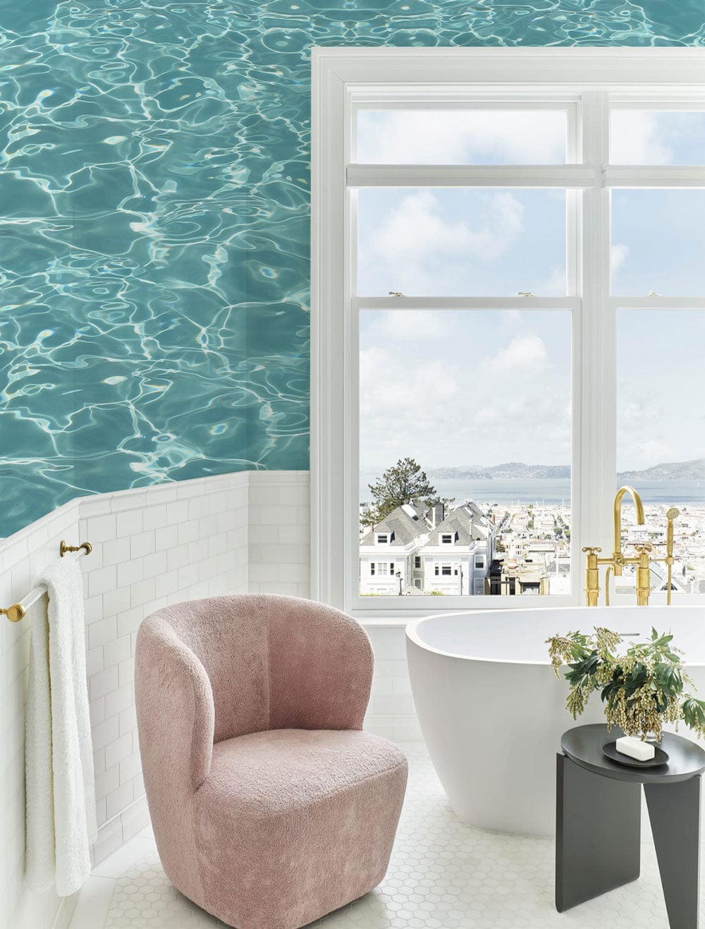 Tranquil Aqua Water Ripple Wallpaper in bathroom, pink chair, hexagonal tiles, white bathtub, window view.
