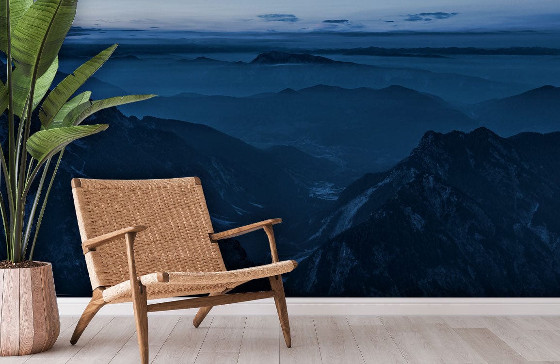 Serene Blue Mountain Vista mural in living room with wicker chair, light wood flooring, and plant.