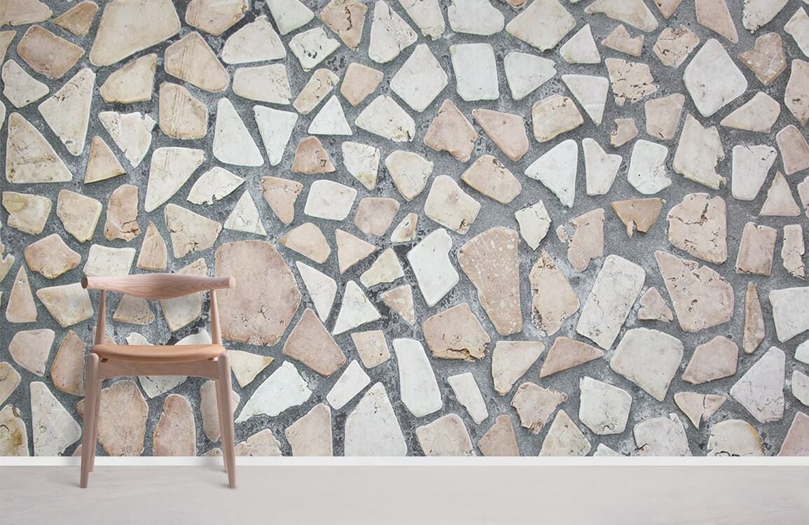 Rustic stone mosaic wallpaper with neutral pebble pattern, wooden chair, grey flooring in minimalist room.