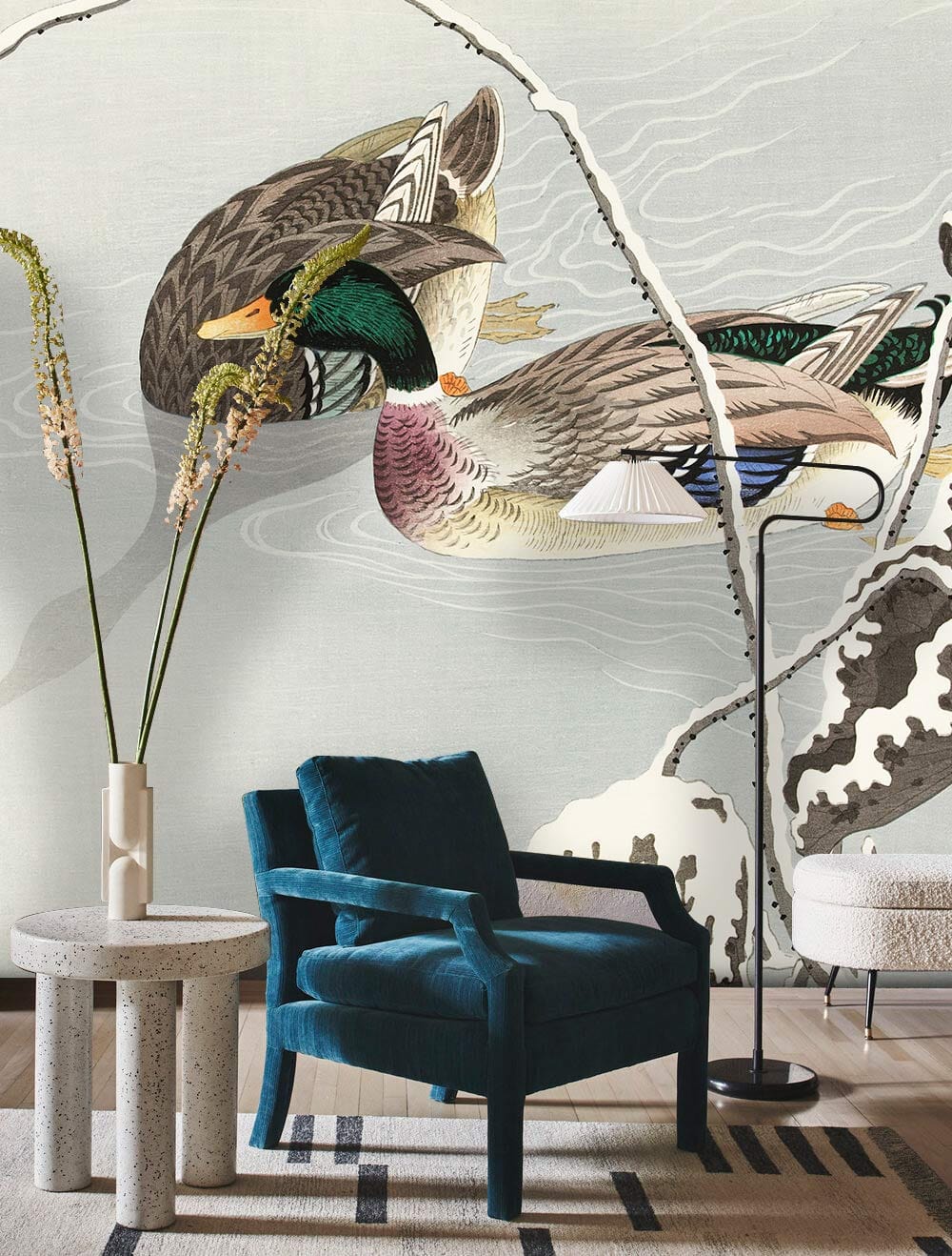Elegant watercolour duck mural wallpaper in soft tones, featuring teal armchair, neutral decor, and rug.