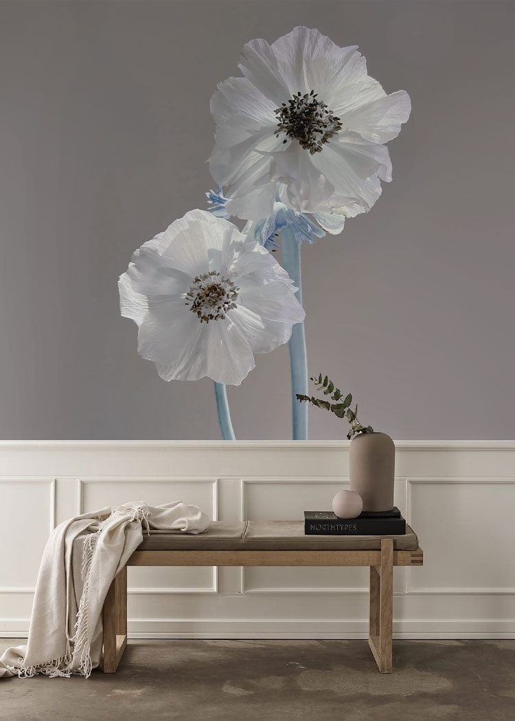 Silent Whisper floral mural wallpaper with bench; elegant grey wall; white wainscoting in serene room.