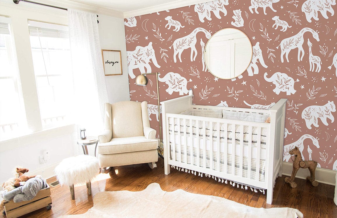 Nursery with Rustic Safari Animal Silhouette Wallpaper, white crib, cream chair, and wooden flooring.