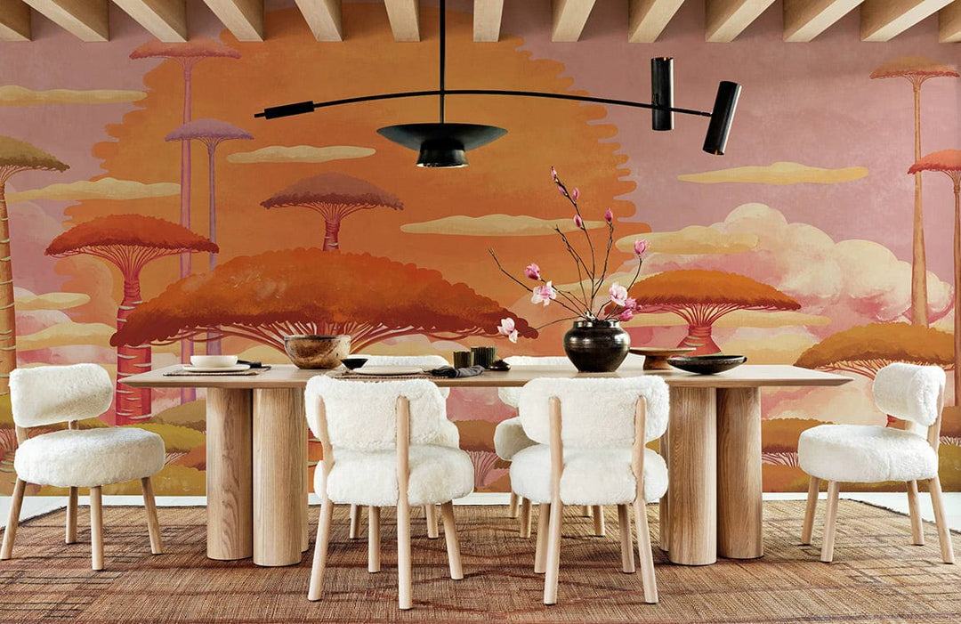 Dining room with Sunset Glow Fantasy Trees mural, wooden table, white chairs, modern black light fixture.