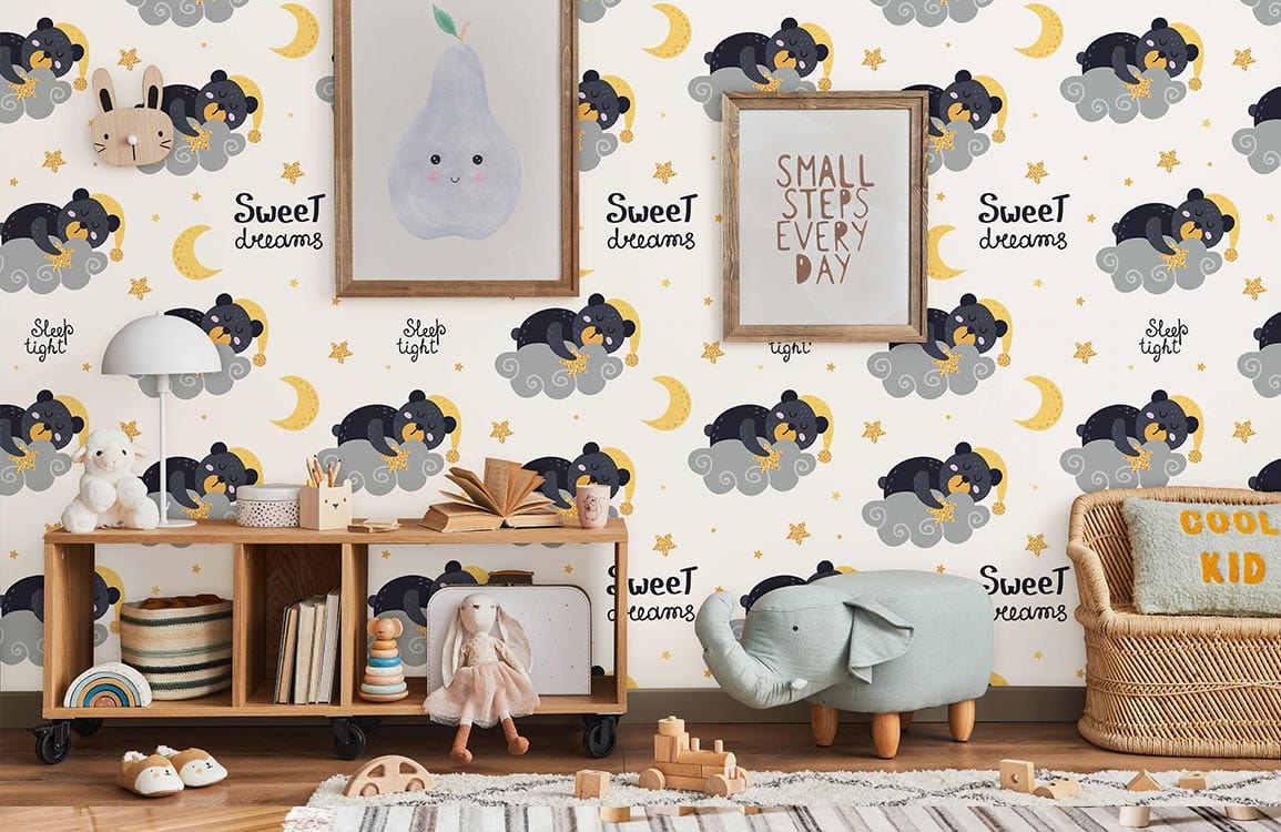 Sweet Dreams grey bear moon stars nursery wallpaper with wooden shelving, plush toys, and framed art.