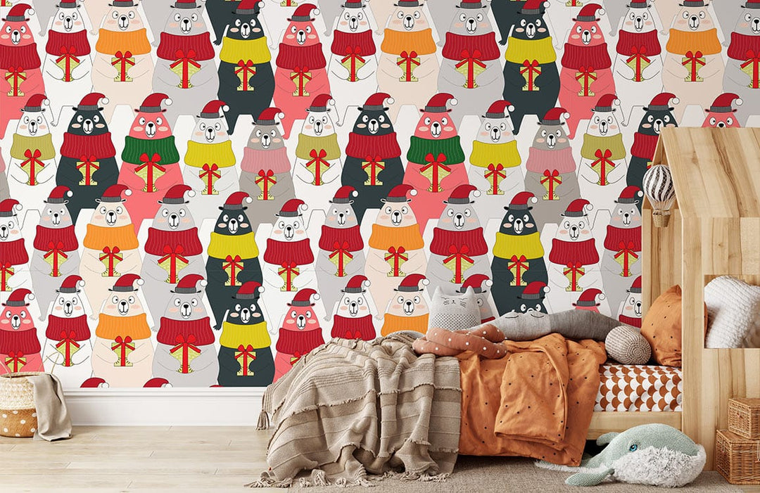 Festive bears mural wallpaper with colourful jumpers, neutral wood flooring, cosy cushions, and throws in bedroom.