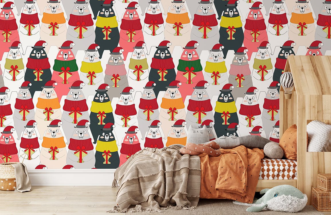 Festive bears mural wallpaper with colourful jumpers, neutral wood flooring, cosy cushions, and throws in bedroom.